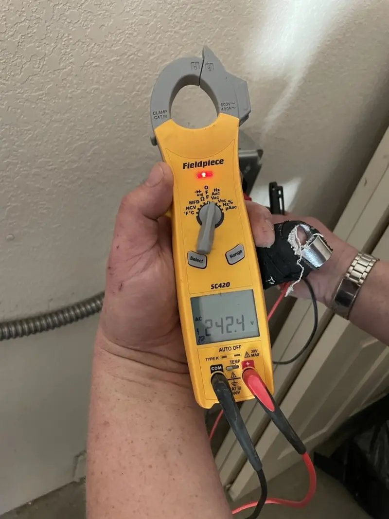 Voltage testing with clamp meter during Whole House Surge Protector in Pinehurst